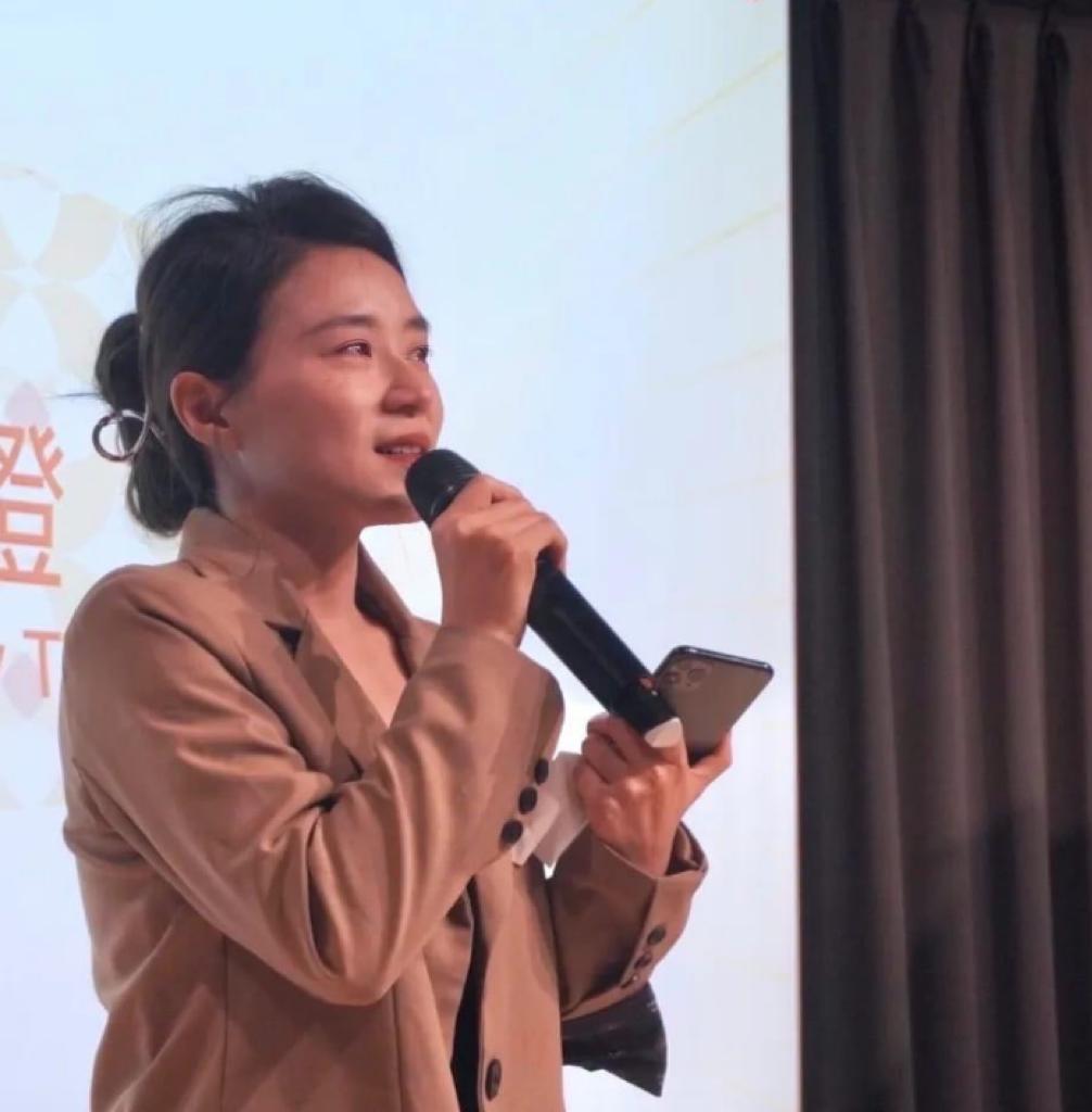 Trixie Dai speaking at an industry event